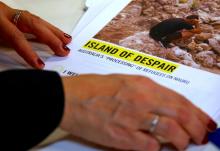 Anna Neistat, Senior Director for Research with Amnesty International, talks to journalists as she holds a copy of a report she co-authored titled 'Island of Despair - Australia's "Processing" of Refugees on Nauru' in Sydney, Australia, October 17, 2016. PHOTO BY REUTERS/David Gray