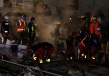 Members of rescue teams search for survivors in the rubble of a collapsed building after an earthquake in Mexico City, Mexico, September 22, 2017. PHOTO BY REUTERS/Henry Romero