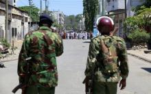 Riot police stand guard along the streets of Majengo Mombasa. PHOTO BY REUTERS/Joseph Okanga