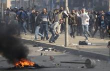 Supporters of Muslim Brotherhood and ousted Egyptian President Mohamed Mursi clash with riot police during clashes at Nasr City district in Cairo