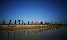 Rohingya refugees make their way to a refugee camp after crossing the Bangladesh-Myanmar border in Palong Khali, near Cox's Bazar, Bangladesh, November 3, 2017. PHOTO BY REUTERS/Hannah McKay