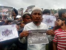 Rohingya Regugee Abdu Shakur, father of one of the victims of Inn Din massacre protests the sentencing of Reuters journalists Wa Lone and Kyaw Soe Oo at Teng Khali camp outside Cox's Bazar in Bangladesh, September 5, 2018. PHOTO BY REUTERS/Poppy McPherson