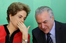 Brazil's President Dilma Rousseff (L) talks to Vice President Michel Temer at the Planalto Palace in Brasilia, Brazil, March 2, 2016. PHOTO BY REUTERS/Adriano Machado