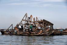 Residents work to dismantle the Makoko floating school after it collapsed in the Makoko fishing community on the Lagos lagoon, Nigeria June 8, 2016. PHOTO BY REUTERS/Akintunde Akinleye