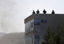 Afghan security forces keep watch on a roof of a building after a group of insurgents stormed a compound used by Afghanistan's intelligence agency in Kabul, Afghanistan, in this file photo taken on July 7, 2015. PHOTO BY REUTERS/Omar Sobhani