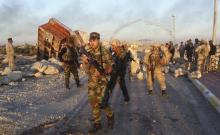 Iraqi security forces gather to advance towards the centre of Ramadi city, December 25, 2015. PHOTO BY REUTERS/Stringer