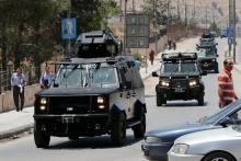 Jordanian security vehicles seen near the General Intelligence directorate offices near al Baqaa Refugee Camp, north of Amman, Jordan, June 6, 2016. PHOTO BY REUTERS/Muhammad Hamed