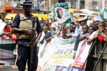 A security official stands guard at a campaign rally for frontline contender and Lagos governorship candidate for the People's Democratic Party (PDP) Jimi Agbaje, in the Ikeja district in Lagos, February 3, 2015. PHOTO BY REUTERS/Akintunde Akinleye