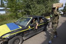 Members of Ukrainian self-defence battalion "Donbass" prepare to relocate to another base in the eastern Ukrainian town of Popasna