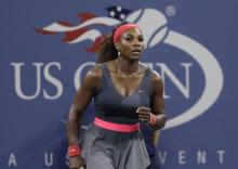 Serena Williams of the U.S. celebrates defeating Francesca Schiavone of Italy