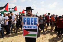A demonstrator takes part in a rally of Israeli Arabs calling for the right of return for refugees who fled their homes during the 1948 Arab-Israeli War, near Atlit, Israel, April 19, 2018. PHOTO BY REUTERS/Ammar Awad