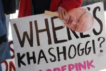 An activist holds a sign and image of missing Saudi journalist Jamal Khashoggi during a demonstration calling for sanctions against Saudi Arabia and to protest Khashoggi's disappearance, outside the White House in Washington, U.S., October 19, 2018. PHOTO BY REUTERS/Leah Millis