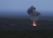 Smoke from fire rises above the ground in Martakert province, after an unmanned military air vehicle was shot down by the self-defense army of Nagorno-Karabakh according to Armenian media, during clashes over the breakaway Nagorno-Karabakh region, April 4, 2016. PHOTO BY REUTERS/Vahram Baghdasaryan