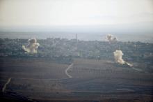 Smoke from explosions rises during fighting in the village of Jubata Al Khashab in Syria, as seen from the Israeli side of the border fence between Syria and the Israeli-occupied Golan Heights, September 11, 2016. PHOTO BY REUTERS/Baz Ratner