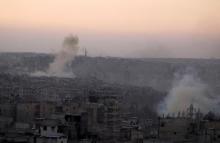 Smoke rises from Bustan al-Basha neighborhood of Aleppo, Syria, October 5, 2016. PHOTO BY REUTERS/Abdalrhman Ismail