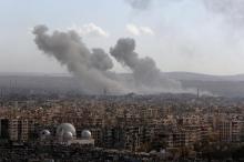 A general view shows rising smoke after strikes on Aleppo city, Syria, December 3, 2016. PHOTO BY REUTERS/Omar Sanadiki