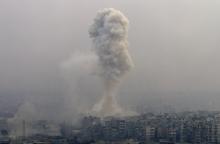 Smoke rises after air strikes on rebel-controlled besieged eastern Aleppo, Syria, December 5, 2016. PHOTO BY REUTERS/Omar Sanadiki