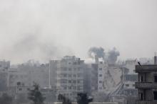 Smoke rises after what activists said was an airstrike by forces loyal to Syria's President Bashar al-Assad in eastern Al-Ghouta, near Damascus, January 25, 2015. PHOTO BY REUTERS/Diaa Al-Din
