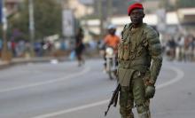 A soldier holds his weapon as he watches a procession by Uganda's leading opposition party Forum for Democratic Change supporters being dispersed in Kampala, Uganda, February 15, 2016. PHOTO BY REUTERS/James Akena