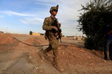 A U.S army soldier walks with his weapon at a military base in the Makhmour area near Mosul during an operation to attack Islamic State militants in Mosul, Iraq, October 18, 2016. PHOTO BY REUTERS/Alaa Al-Marjani