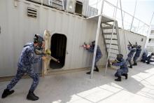 Bahraini Royal Navy special task force show their skills during a media demonstration for the International Mine Countermeasures Exercise (IMCMEX) at the Bahrain Naval Support Unit, Fifth Fleet Command centre in Manama, Bahrain, April 9, 2016. PHOTO BY REUTERS/Hamad I Mohammed