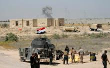 Iraqi security forces gather near Falluja, Iraq, May 31, 2016. PHOTO BY REUTERS/Thaier Al-Sudani
