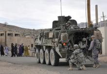 Soldiers from U.S. Army Alpha Company, 2-3 Inf, 3-2 SBCT, patrol a village with Afghan forces at the National Training Center in Fort Irwin, California, U.S. on August 13, 2011. PHOTO BY REUTERS/Courtesy Ryan Hallock/U.S. Army