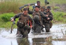 U.S. military forces cross a flooded area near the shore during the annual Philippines-US amphibious landing exercise (PHIBLEX) at San Antonio, Zambales province, Philippines, October 7, 2016. PHOTO BY REUTERS/Romeo Ranoco