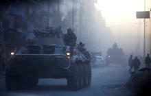 Russian soldiers, on armured vehicles, patrol a street in Aleppo, Syria, February 2, 2017. PHOTO BY REUTERS/Omar Sanadiki