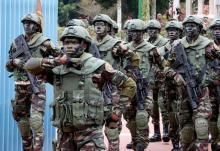 Soldiers from Ivory Coast's Special Forces march in a military parade, marking Independence day, near the presidential palace in Abidjan, August 7, 2016. PHOTO BY REUTERS/Thierry Gouegnon