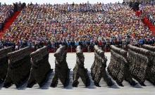 Soldiers of China's People's Liberation Army (PLA) march during the military parade to mark the 70th anniversary of the end of World War Two, in Beijing, China, September 3, 2015. PHOTO BY REUTERS/Damir Sagolj