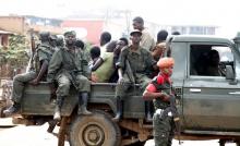 Congolese soldiers ride on their pick-up truck in a file photo. PHOTO BY REUTERS/Kenny Katombe