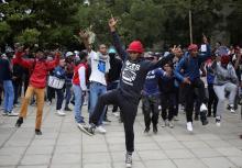 Students chant slogans during clashes with the South African police protect at Johannesburg's University of the Witwatersrand, South Africa, October 4, 2016. PHOTO BY REUTERS/Siphiwe Sibeko