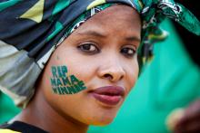 An African National Congress (ANC) supporter arrives at a memorial service for Winnie Madikizela-Mandela at Orlando Stadium in Johannesburg's Soweto township, South Africa, April 11, 2018. PHOTO BY REUTERS/Siphiwe Sibeko