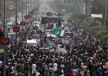 Supporters of cricketer-turned-opposition politician Imran Khan take part in the Freedom March in Gujranwala