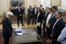 Greek Prime Minister Alexis Tsipras (2nd L) looks on as Greek President Prokopis Pavlopoulos (L) leads a swearing in ceremony under political oath of newly appointed members of the government at the Presidential Palace in Athens, Greece, July 18, 2015. PHOTO BY REUTERS/Alkis Konstantinidis