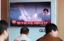People watch a TV broadcast of a news report on North Korea firing what appeared to be several land-to-ship missiles off its east coast, at a railway station in Seoul, South Korea, June 8, 2017. PHOTO BY REUTERS/Kim Hong-Ji