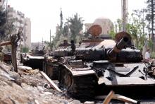 A damaged military vehicle is seen at the city of Douma in Damascus, Syria, April 20, 2018. PHOTO BY REUTERS/Omar Sanadiki