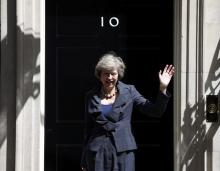 Britain's Home Secretary Theresa May, who is due to take over as prime minister on Wednesday, waves as she leaves after a cabinet meeting at number 10 Downing Street, in central London, Britain, July 12, 2016. PHOTO BY REUTERS/Peter Nicholls
