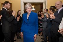 Britain's Prime Minister Theresa May and her husband Philip are welcomed by staff inside 10 Downing Street, in London, Britain, June 9, 2017. PHOTO BY REUTERS/Stefan Rousseau