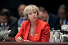 Britain's Prime Minister Theresa May listens to the speech of China's President Xi Jinping during the opening ceremony of the G20 Summit in Hangzhou, China, September 4, 2016. PHOTO BY REUTERS/Nicolas Asfonri