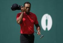 Tiger Woods of the U.S. tips his cap on the 18th green after finishing his final round of the British Open Championship at the Royal Liverpool Golf Club in Hoylake, northern England