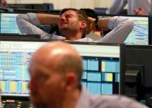 A trader from BGC, a global brokerage company in London's Canary Wharf financial centre reacts during trading June 24, 2016 after Britain voted to leave the European Union in the EU BREXIT referendum. PHOTO BY REUTERS/Russell Boyce