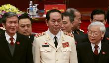 Vietnam's Public Security (Police) Minister General Tran Dai Quang (C) stands with Communist Party's General Secretary Nguyen Phu Trong (R) and Politburo member Dinh The Huynh (L) at a closing ceremony of 12th National Congress of the Party in Hanoi, January 28, 2016. PHOTO BY REUTERS/Kham