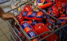 A worker pulls a trolley after removing processed meat products at a Pick n Pay Store in Johannesburg, South Africa, March 5, 2018. PHOTO BY REUTERS/Siphiwe Sibeko