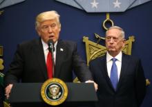 U.S. Defense Secretary James Mattis (R) listens to remarks by U.S. President Donald Trump after a swearing-in ceremony for Mattis at the Pentagon in Washington, U.S., January 27, 2017. PHOTO BY REUTERS/Carlos Barria