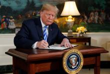 U.S. President Donald Trump signs a proclamation declaring his intention to withdraw from the JCPOA Iran nuclear agreement in the Diplomatic Room at the White House in Washington, U.S., May 8, 2018. PHOTO BY REUTERS/Jonathan Ernst