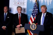 U.S. President Donald Trump gives a press briefing with U.S. National Security Advisor John Bolton and Larry Kudlow at the G7 summit in the Charlevoix city of La Malbaie, Quebec, Canada, June 9, 2018. PHOTO BY REUTERS/Leah Millis