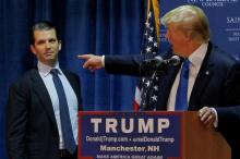 Donald Trump welcomes his son Donald Trump Jr. to the stage in New Hampshire, November 2015. PHOTO BY REUTERS/Brian Snyder