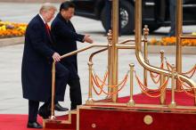 U.S. President Donald Trump takes part in a welcoming ceremony with China's President Xi Jinping in Beijing, China, November 9, 2017. PHOTO BY REUTERS/Damir Sagolj